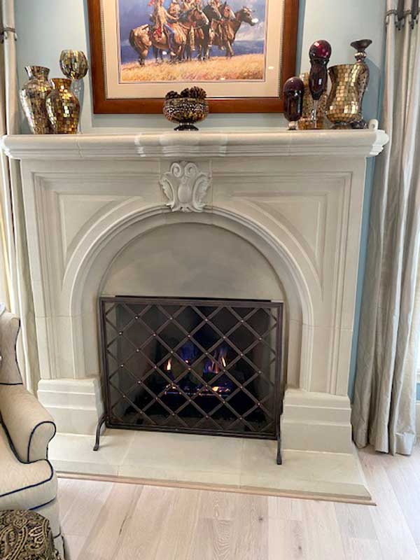 Iron Weave Single-Panel Fireplace Screen, shown in a room setting