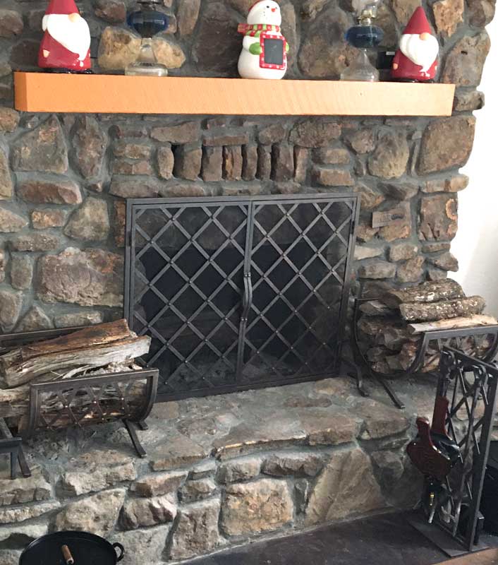 Iron Weave Wood Holder, shown in a room setting