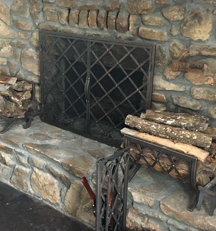Iron Weave Wood Holder, shown in a room setting